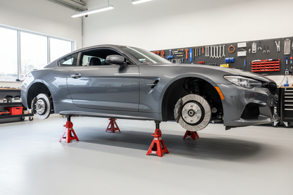 Intact car on axle stands with Wheels off